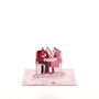A Toast to Us 3D pop-up card angle view: dinner date pop-up on a pale pink heart-doodle base, everpop
