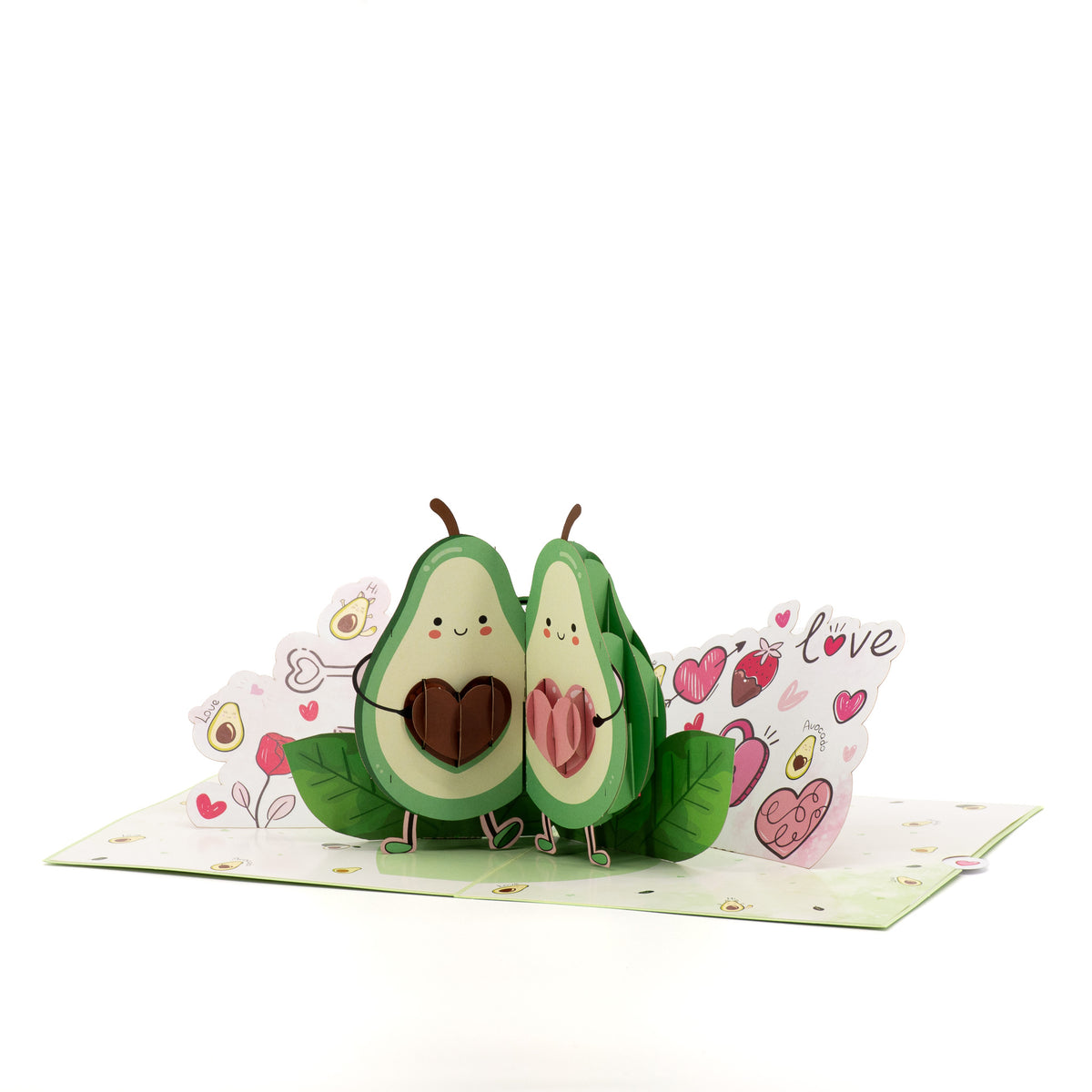 Avocado in Love 3D pop-up card angle view: avocado pair pop-up with leaves on a love-doodle base, everpop