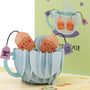 Best Teas 3D pop-up card close-up: smiling tea bag friends peeking out of a paper teacup, everpop