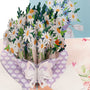 Daisy Days 3D pop-up card close-up: white daisies and cornflowers in heart-print wrap with bow, everpop