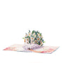 Daisy Days 3D pop-up card angle view: daisy bouquet pop-up on a pink watercolor floral base, everpop