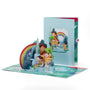 Dancing in the Rain 3D pop-up card front view: kids in raincoats under a rainbow, blue cover behind, everpop
