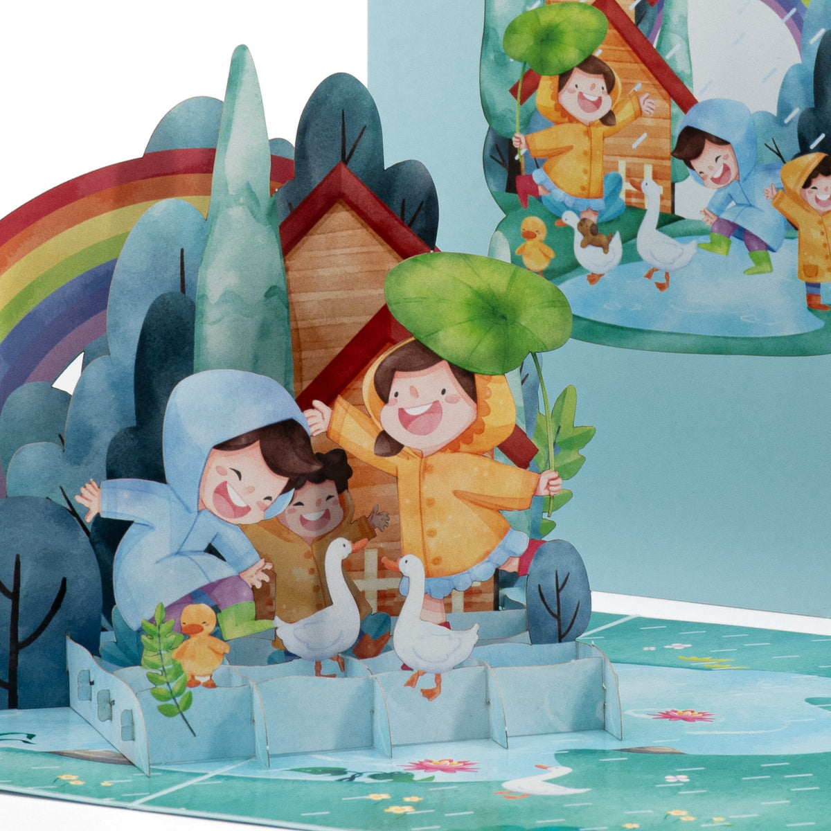 Dancing in the Rain 3D pop-up card close-up: three laughing children in rain gear with geese and ducks, everpop