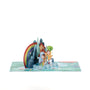 Dancing in the Rain 3D pop-up card angle view: rainbow and cottage pop-up over a pond and meadow base, everpop