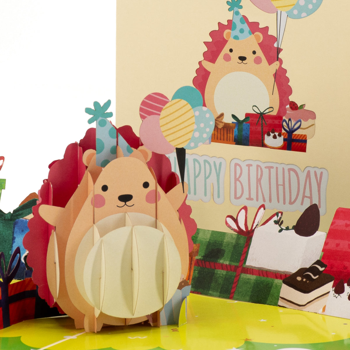 Happy Hedgehog Birthday 3D pop-up card close-up: cute hedgehog holding balloons beside wrapped gifts and cake, everpop