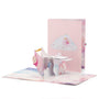 It's a Girl! Stork 3D pop-up card front view: stork carrying a baby girl, pink cloud cover behind, everpop