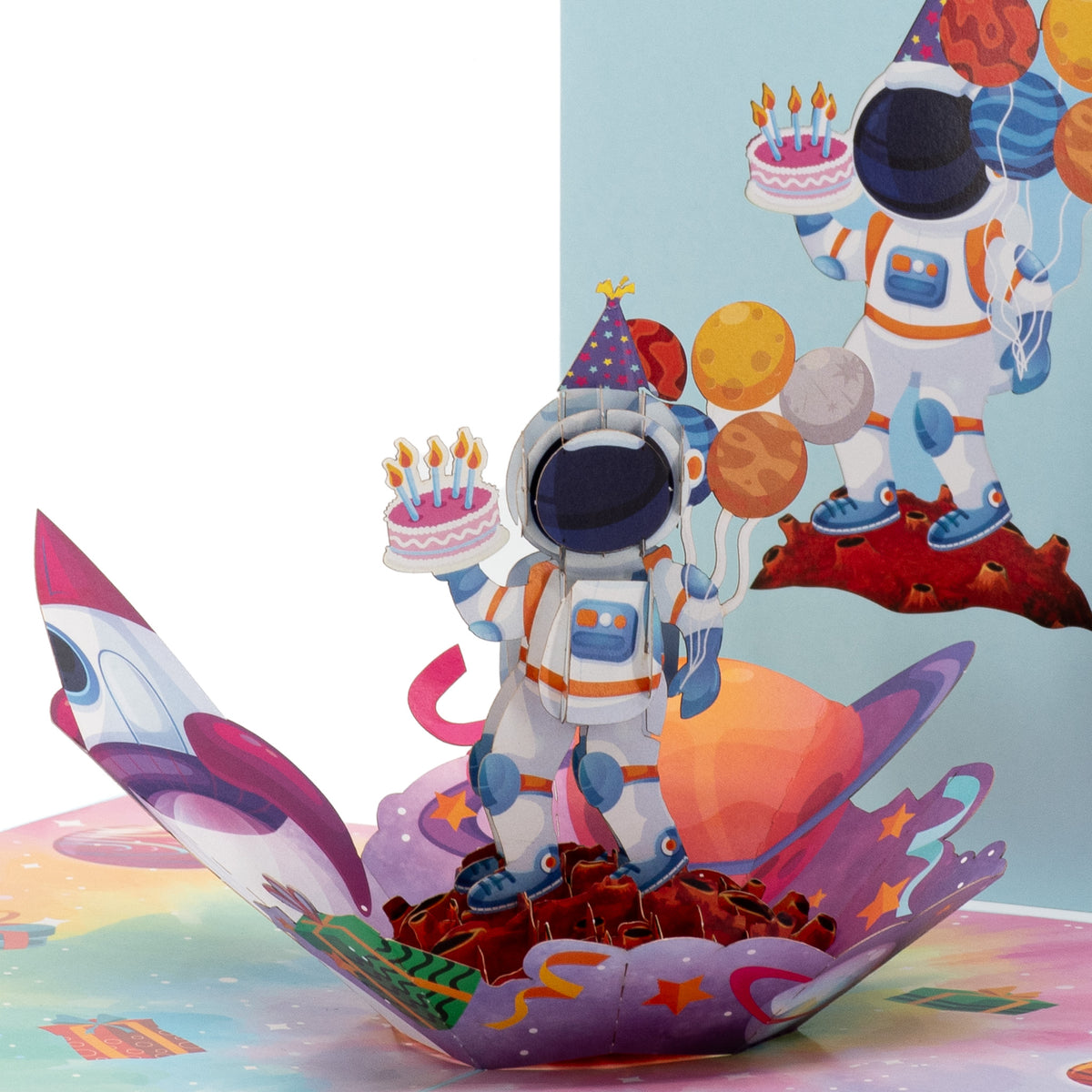 Love You to the Moon Birthday 3D pop-up card close-up: party-hat astronaut holding a cake beside the rocket, everpop