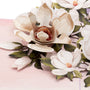 Magnolia Blossom 3D pop-up card close-up: layered paper magnolias with golden centers and leaves, everpop