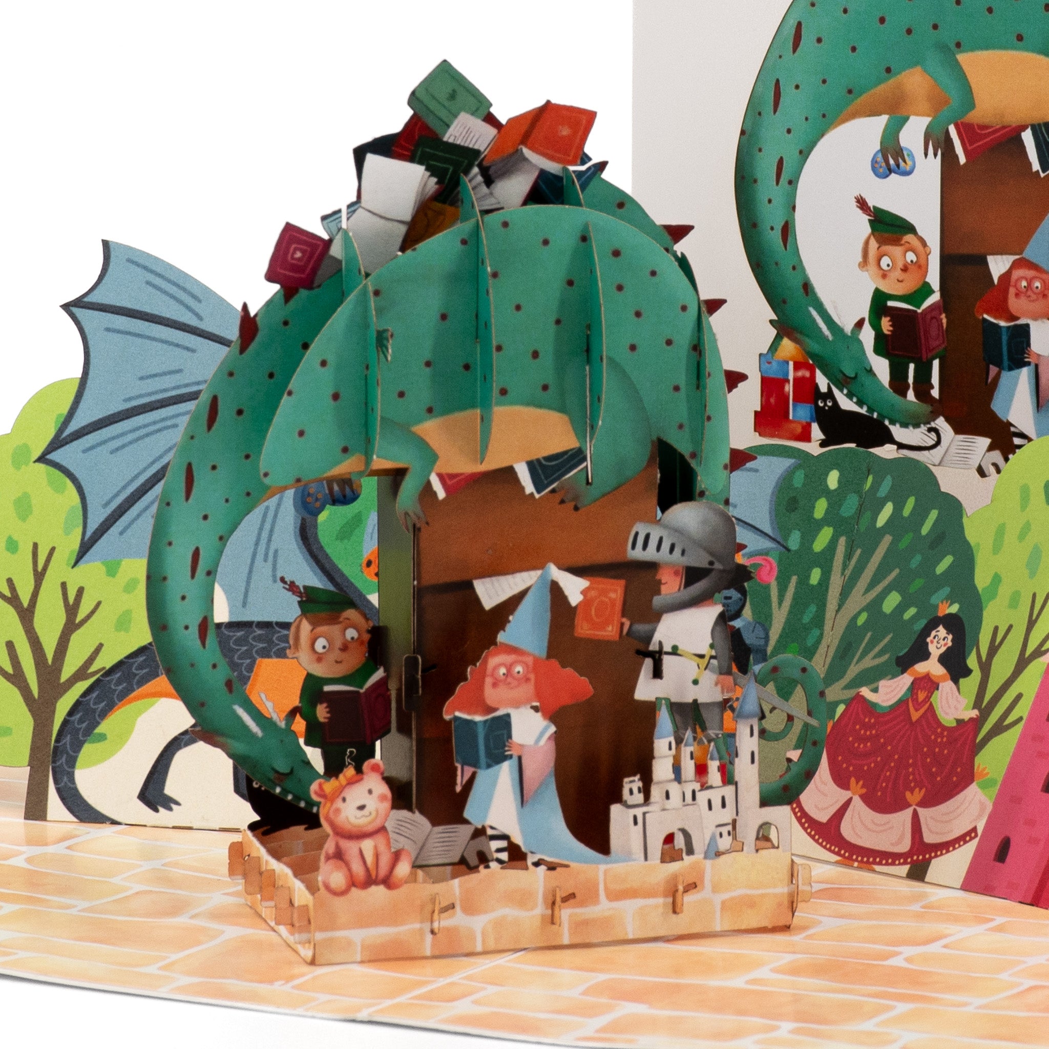 Once Upon an Island 3D pop-up card close-up: green dragon stacked with books above fairytale readers, everpop