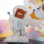 Teddy Takes Flight 3D pop-up card close-up: teddy in a spacesuit waving from pastel paper clouds, everpop