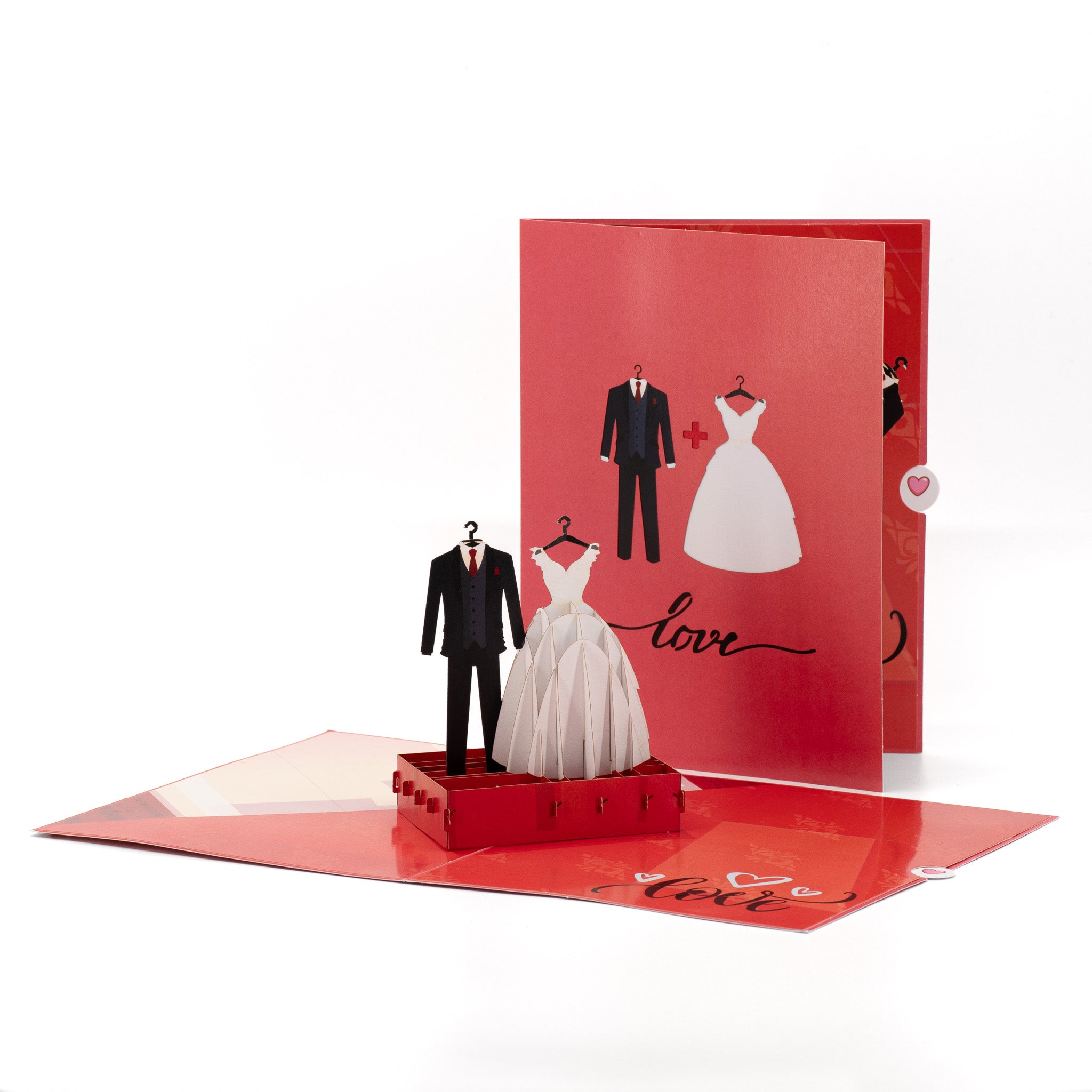 The Wedding Suit & Gown 3D pop-up card front view: wedding suit and gown on hangers, red love cover behind, everpop