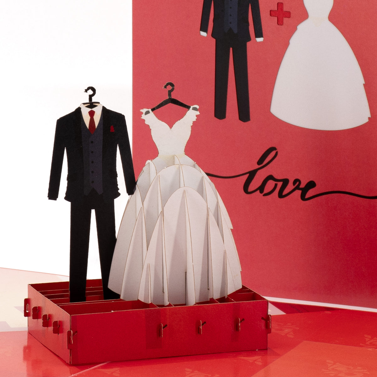 The Wedding Suit & Gown 3D pop-up card close-up: groom's black suit beside a layered white bridal gown, everpop