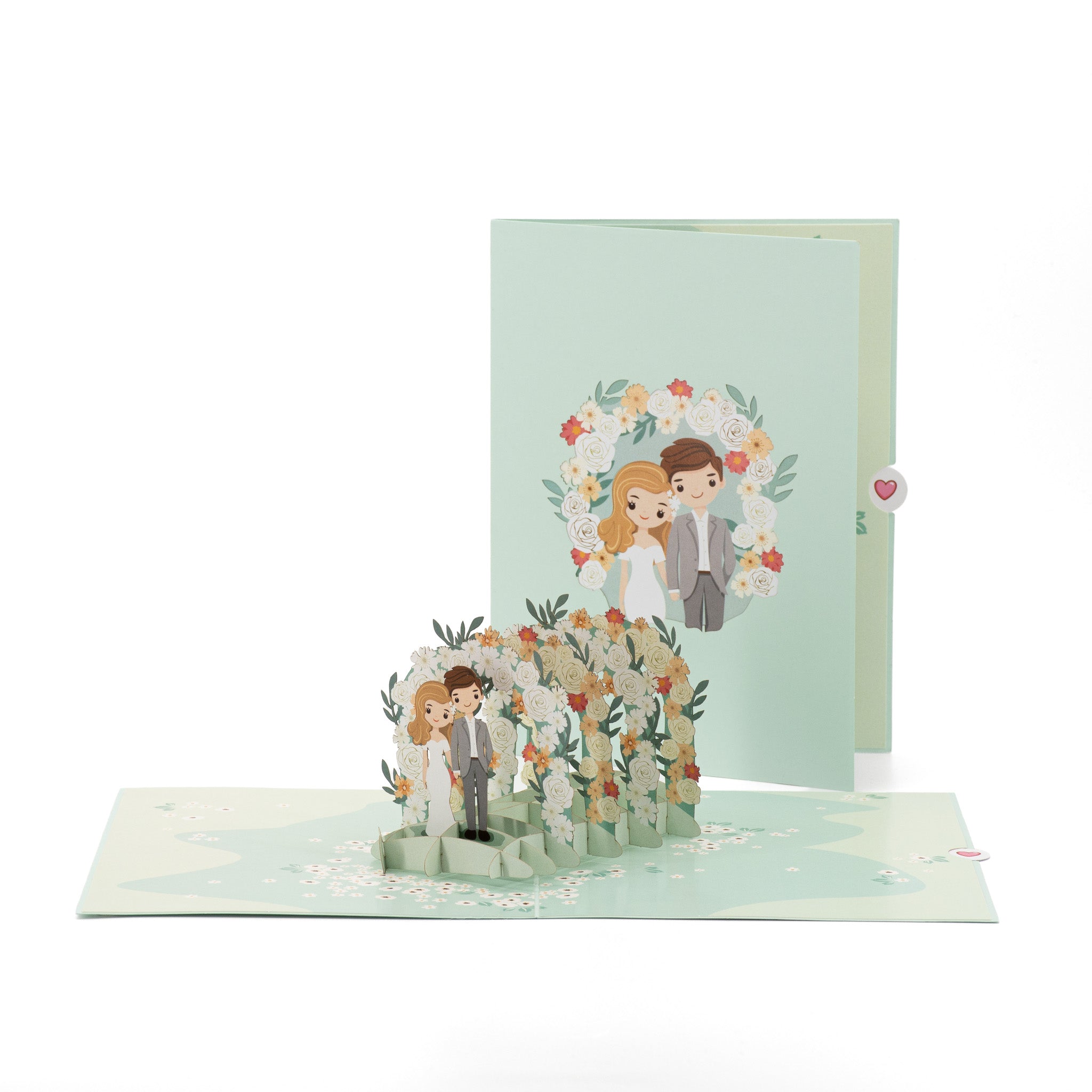 Through the Garden Gate 3D pop-up card front view: bride and groom under a flower arch, mint cover behind, everpop