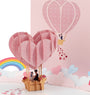 Up in the Clouds 3D pop-up card close-up: pink heart balloon with a kissing pair in the basket, everpop