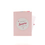 We Have a Surprise 3D pop-up card closed — card only, pink cover with We Have a Surprise for You text, everpop
