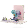 You're One of a Kind Birthday 3D pop-up card front view: baby dinosaur hatching with a bouquet, egg cover behind, everpop